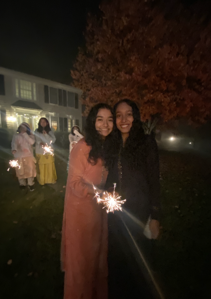 Sophomore Manasvi Singh lights firecrackers with her friend Joy Raichura, on Nov. 12, 2023. 
Used with permission of Manasvi Singh